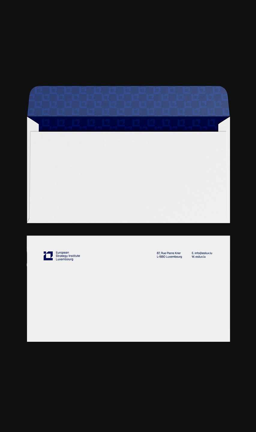 ESILUX branded envelope design showing patterned navy blue interior lining and clean white exterior with institutional logo and address