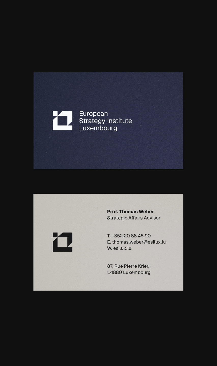 ESILUX business card design — navy front with white logo and light grey back with contact details for Strategic Affairs Advisor