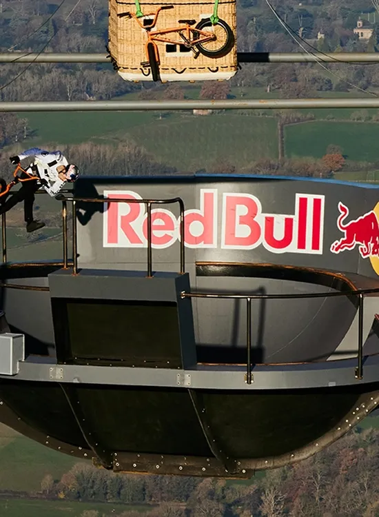 Kris Kyle BMX stunt on a floating skate park suspended from a hot air balloon.