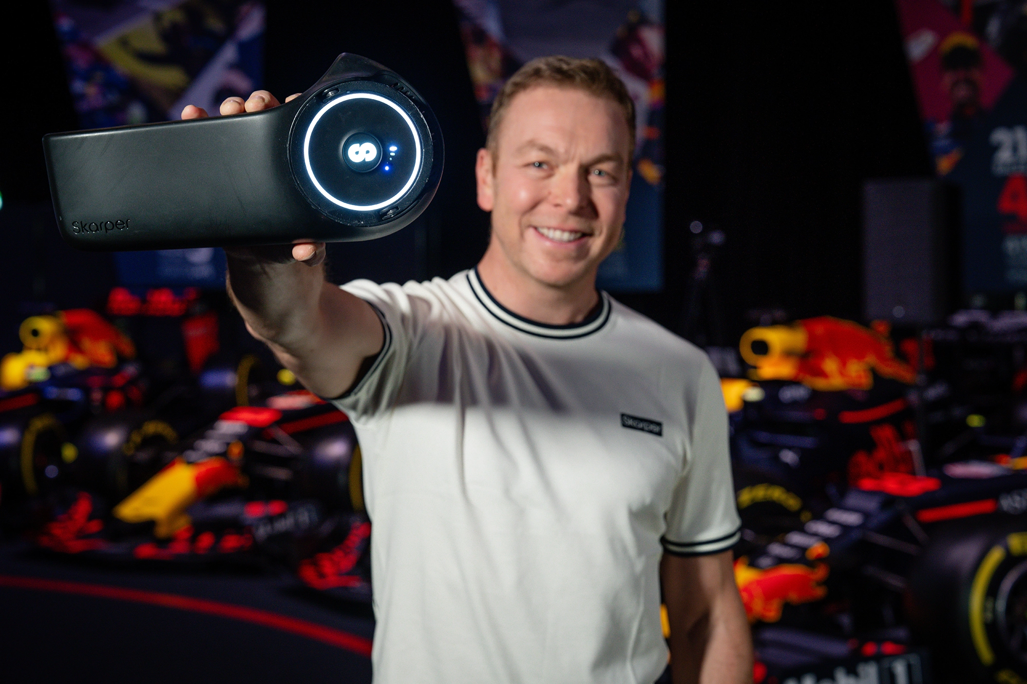 Sir Chris Hoy holding the Skarper e-bike clip-on.
