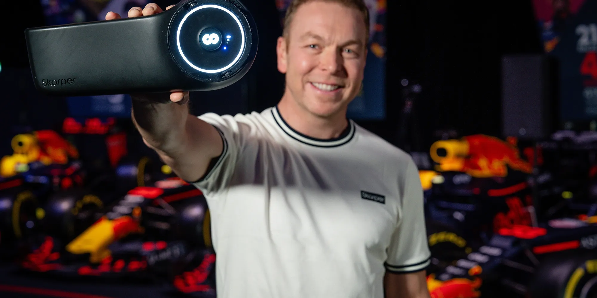 Sir Chris Hoy holding the Skarper e-bike clip-on.