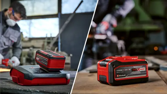Einhell Power X-Change 18V 8Ah Lithium-Ionen Akku auf Ladegerät, Handwerker arbeitet im Hintergrund in Werkstatt.