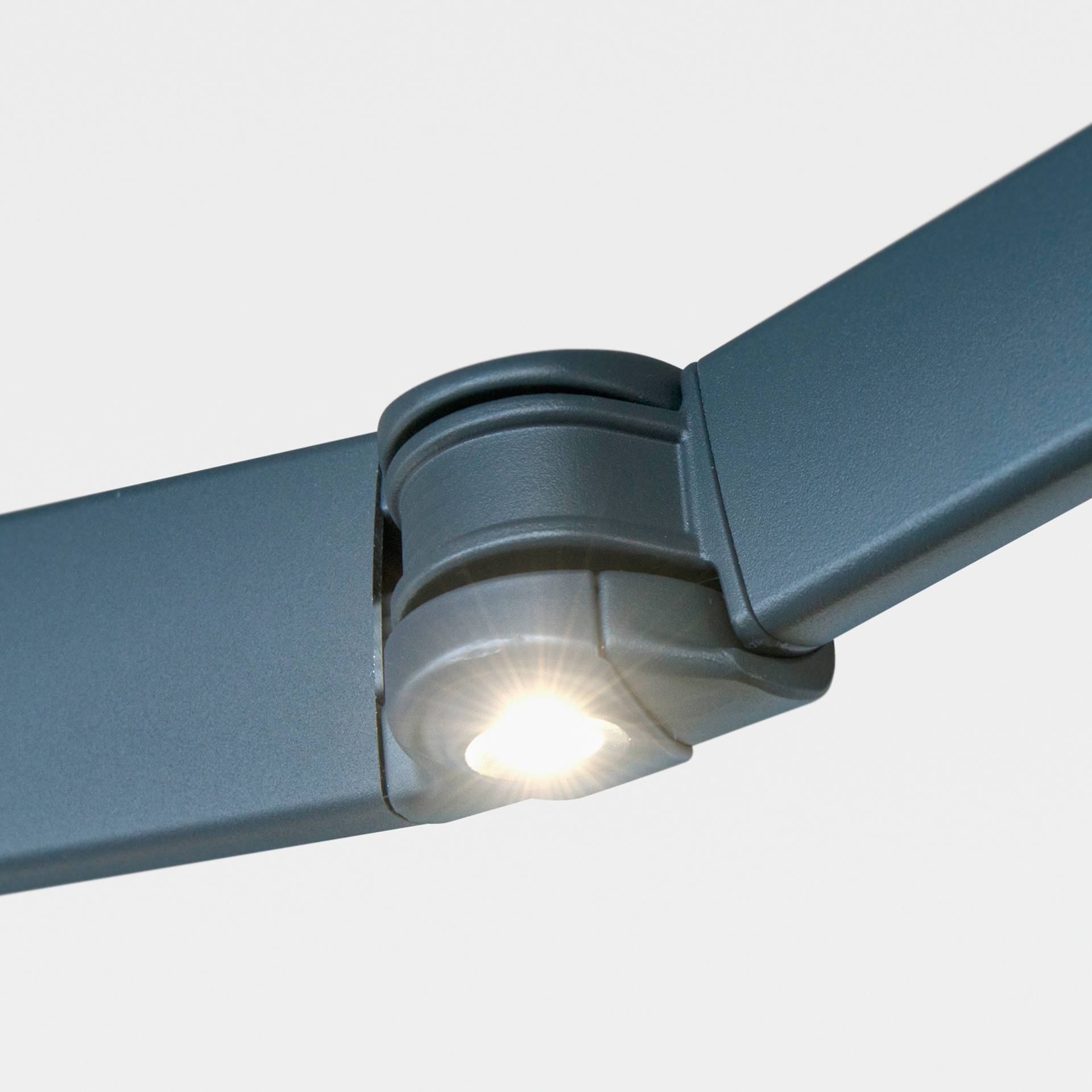 LED spot in the elbow joint of a folding arm of an awning