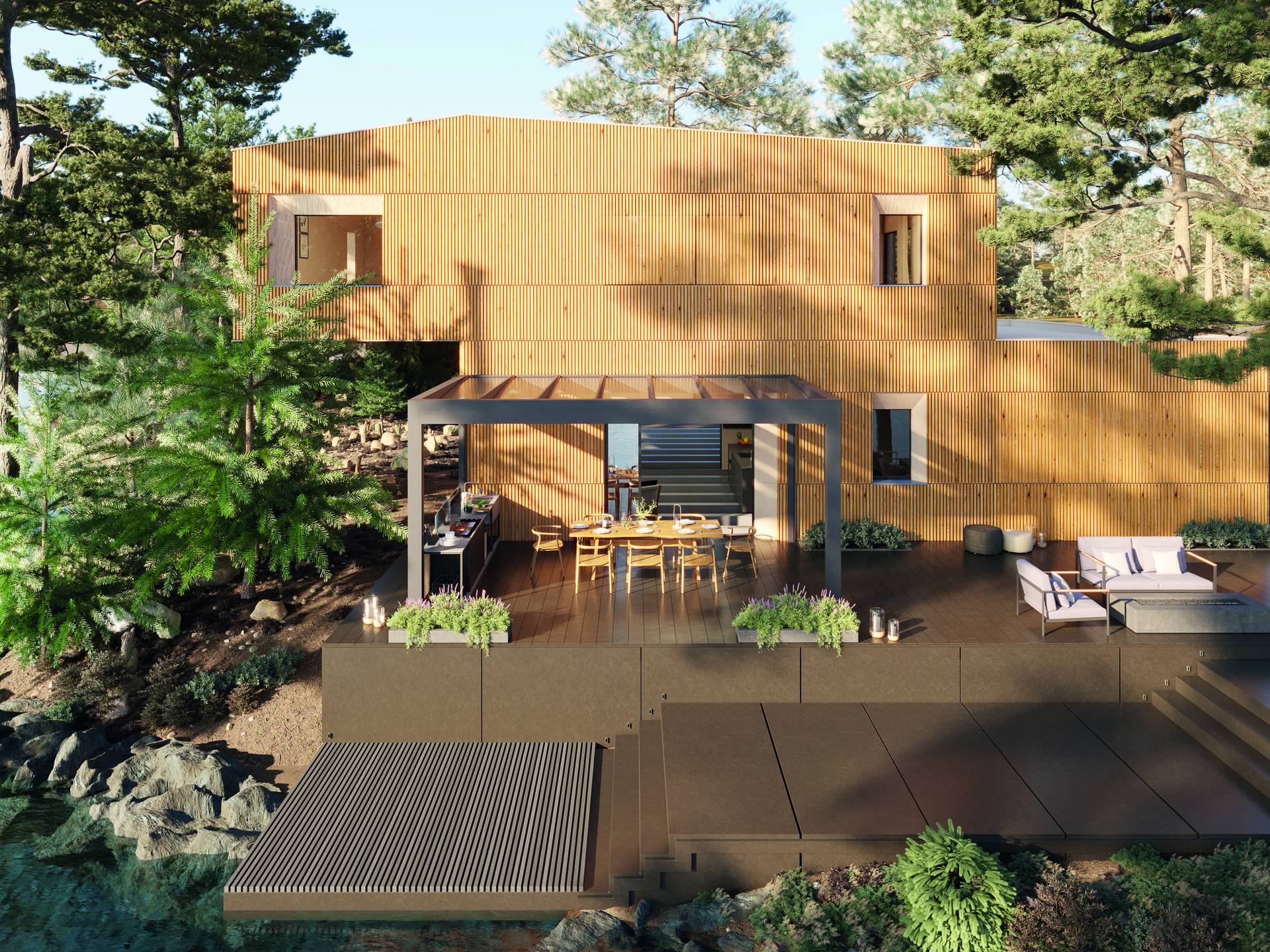 Pergola B800 en aluminium avec toit en verre couvrant une cuisine extérieure et un espace repas sur une terrasse à plusieurs niveaux près d’une maison moderne en bois