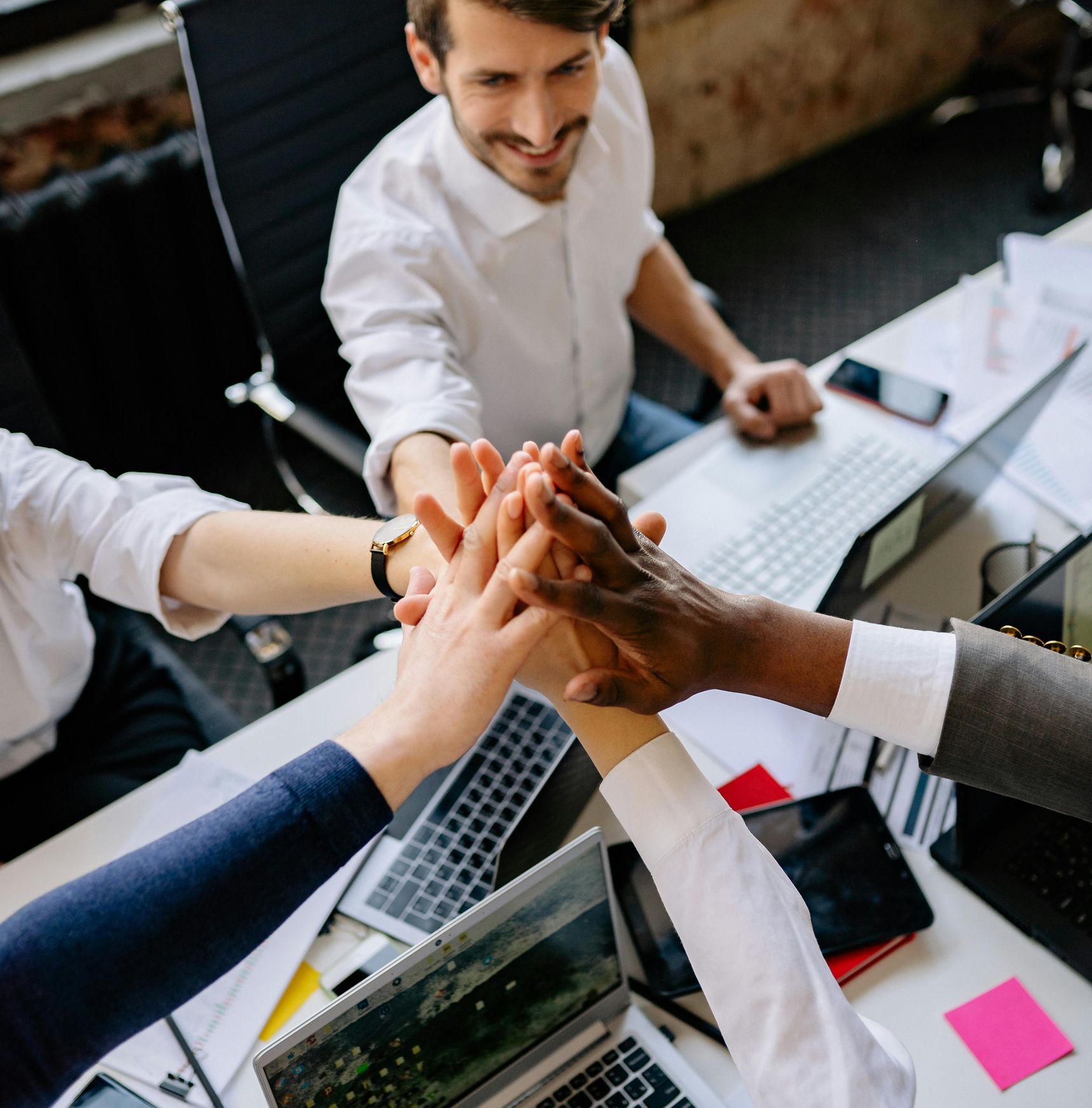 A team celebrating success, showcasing the positive impact of people analytics and HR consulting on workforce engagement and organizational culture.