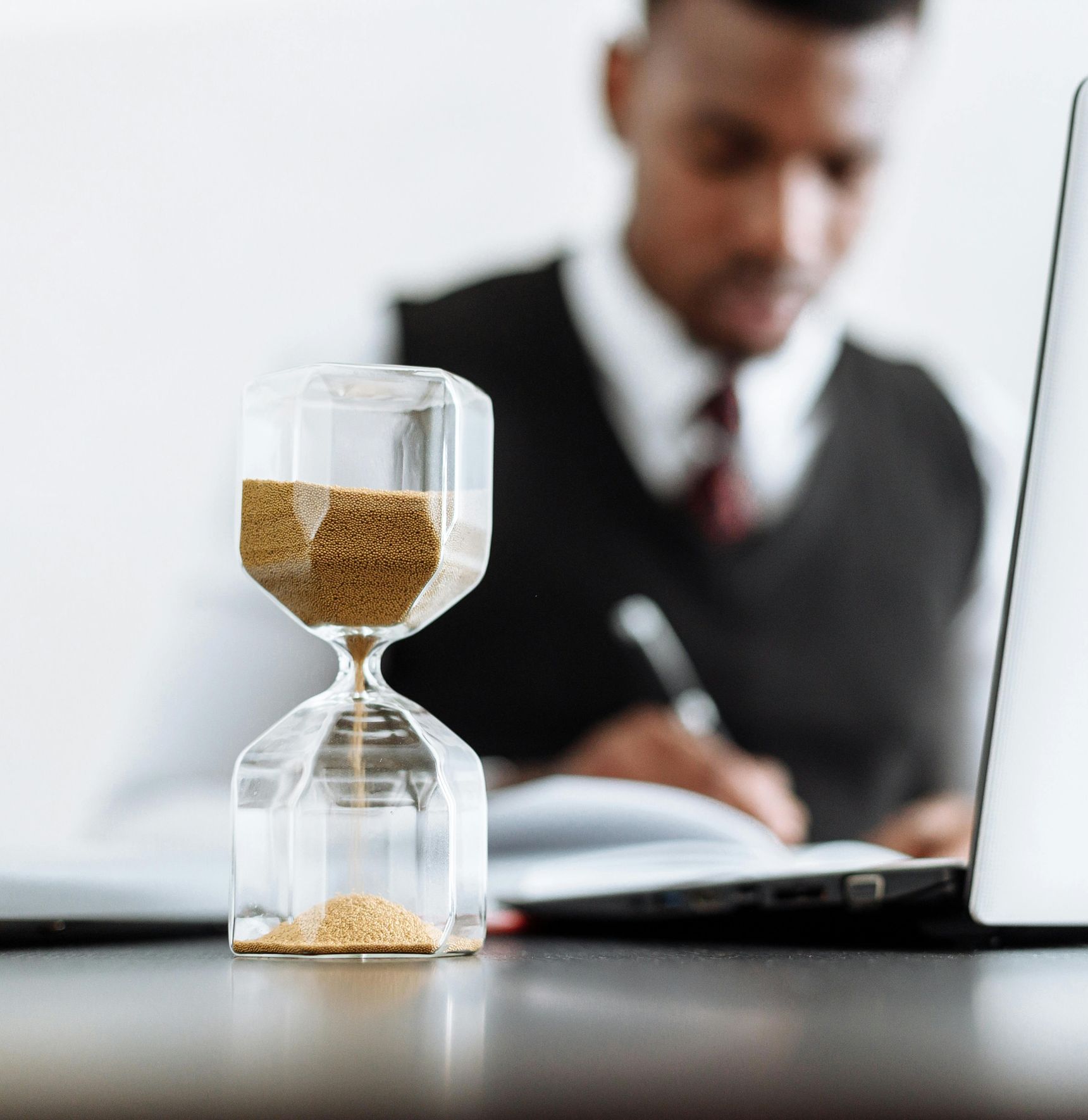 Hourglass representing time as consultants improve processes, efficiency, and organizational performance for operational excellence.