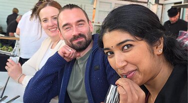 Team members smiling together