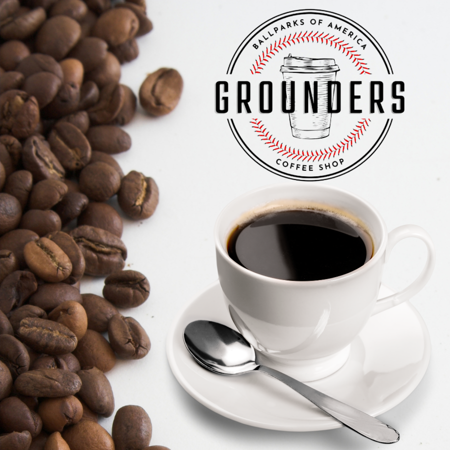 Coffee beans beside a white cup of black coffee with the Grounders Coffee Shop logo above.