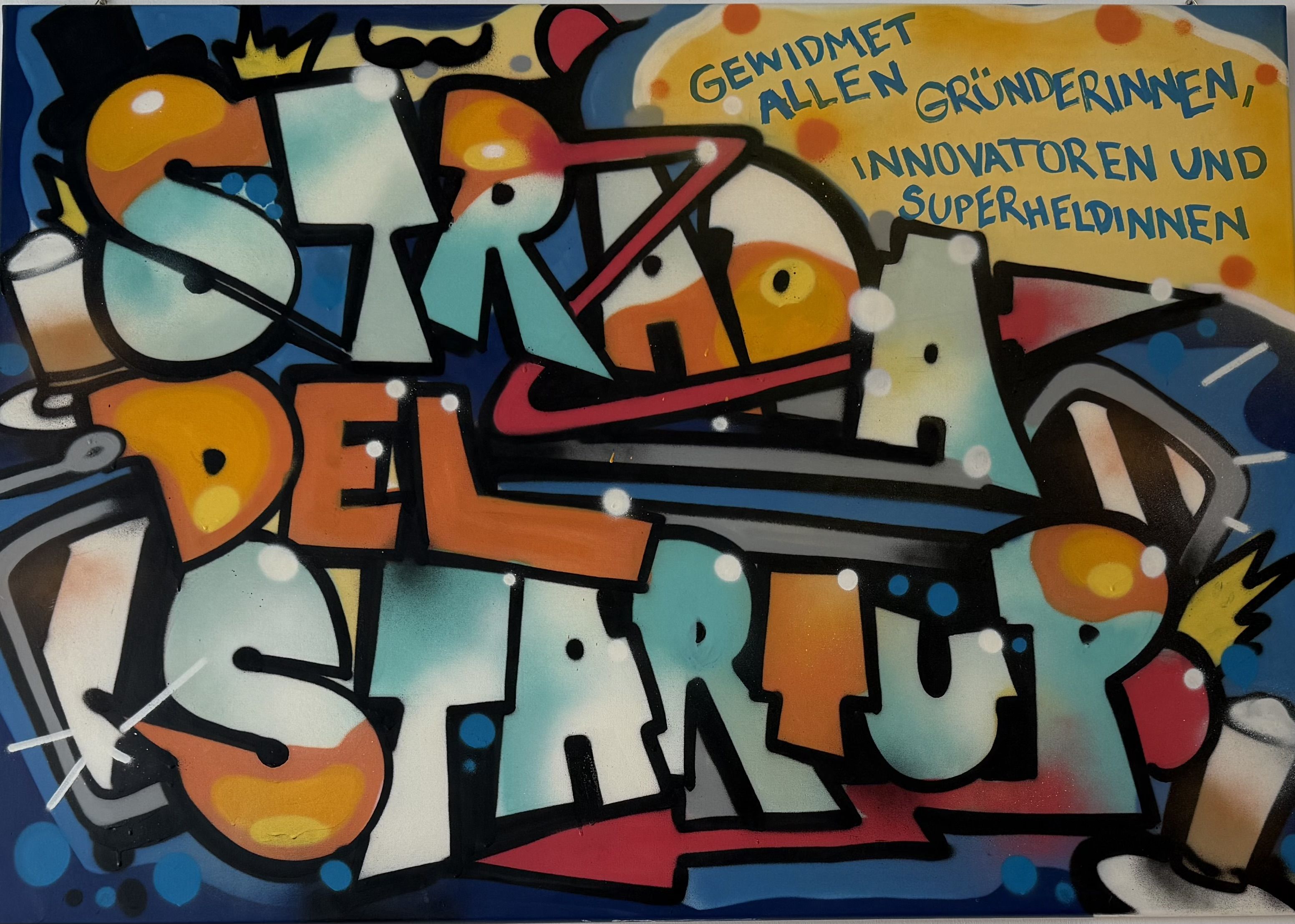 Colorful graffiti-style mural with text "Straße der Startup" and a message dedicated to founders, innovators, and superheroes in German.