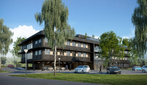 Three-story modern building with large windows surrounded by trees and parked cars