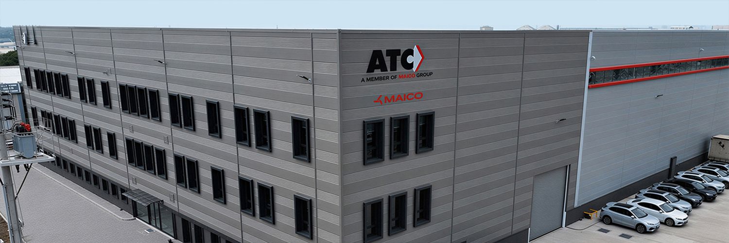 Large grey industrial building with the letters “ATC a member of Maico Group” on the corner of the building.