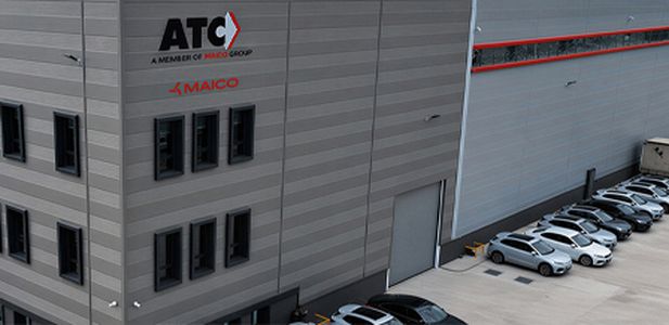 Large grey industrial building with the letters “ATC a member of Maico Group” on the corner of the building.