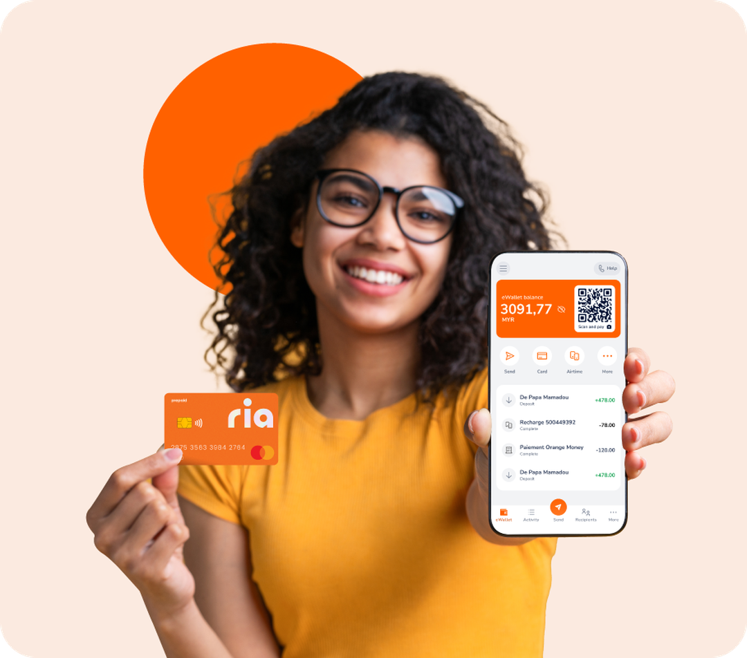 Woman in yellow shirt holding Ria prepaid card and phone displaying money transfer app with wallet balance 3091.77 and transaction history.