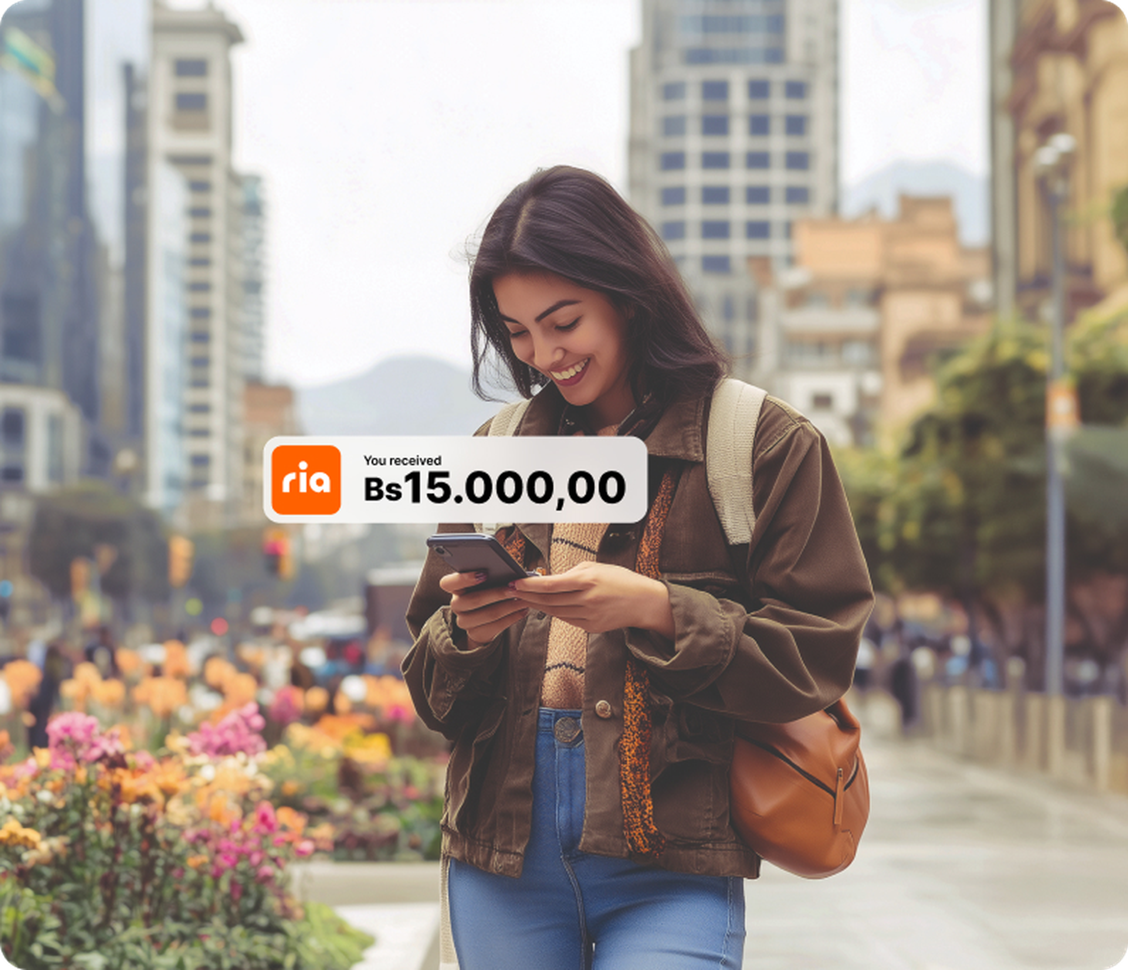 A happy Ria customer sending money to Pago Móvil