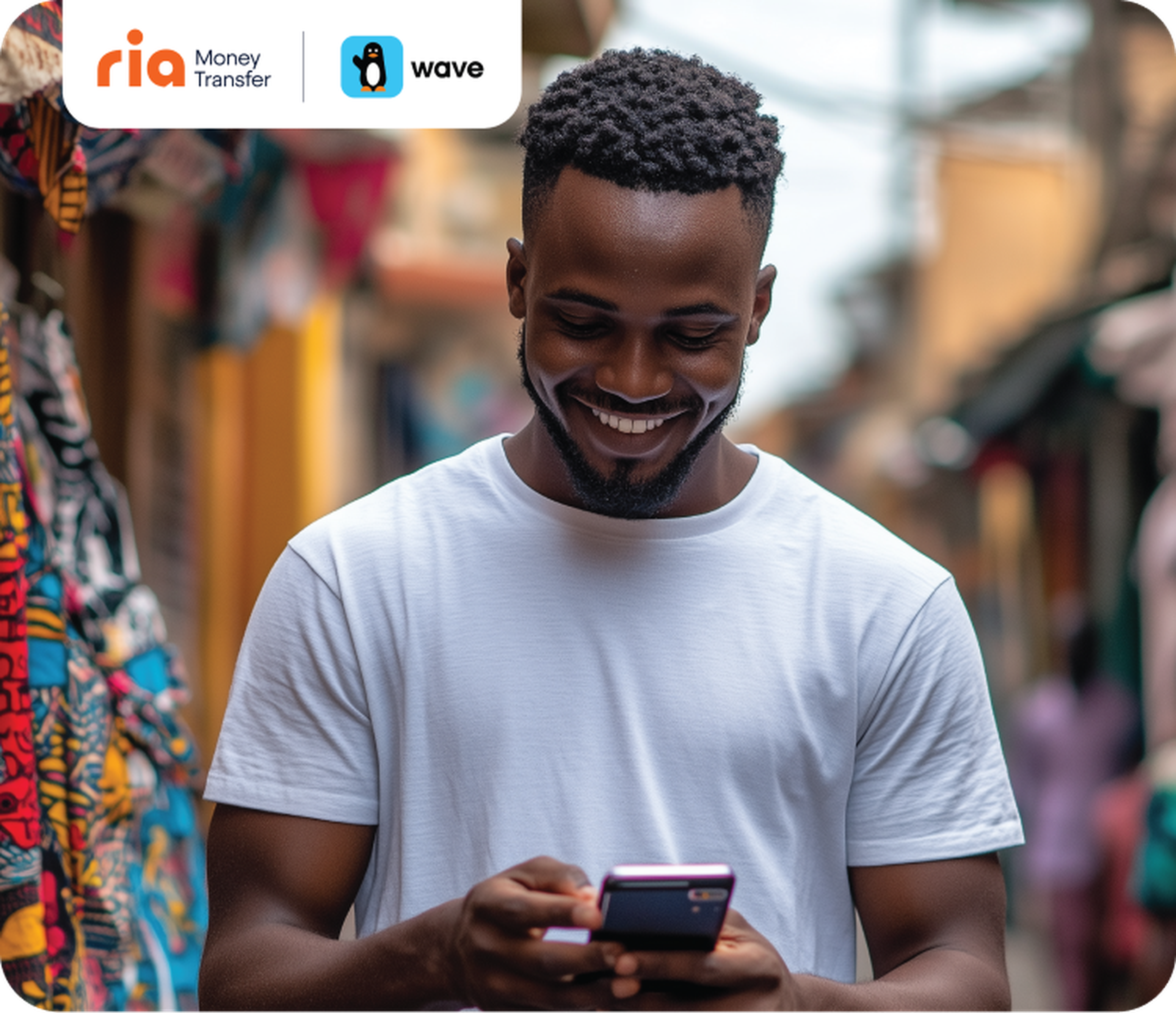 Person smiling at their phone with Ria and Wave logos