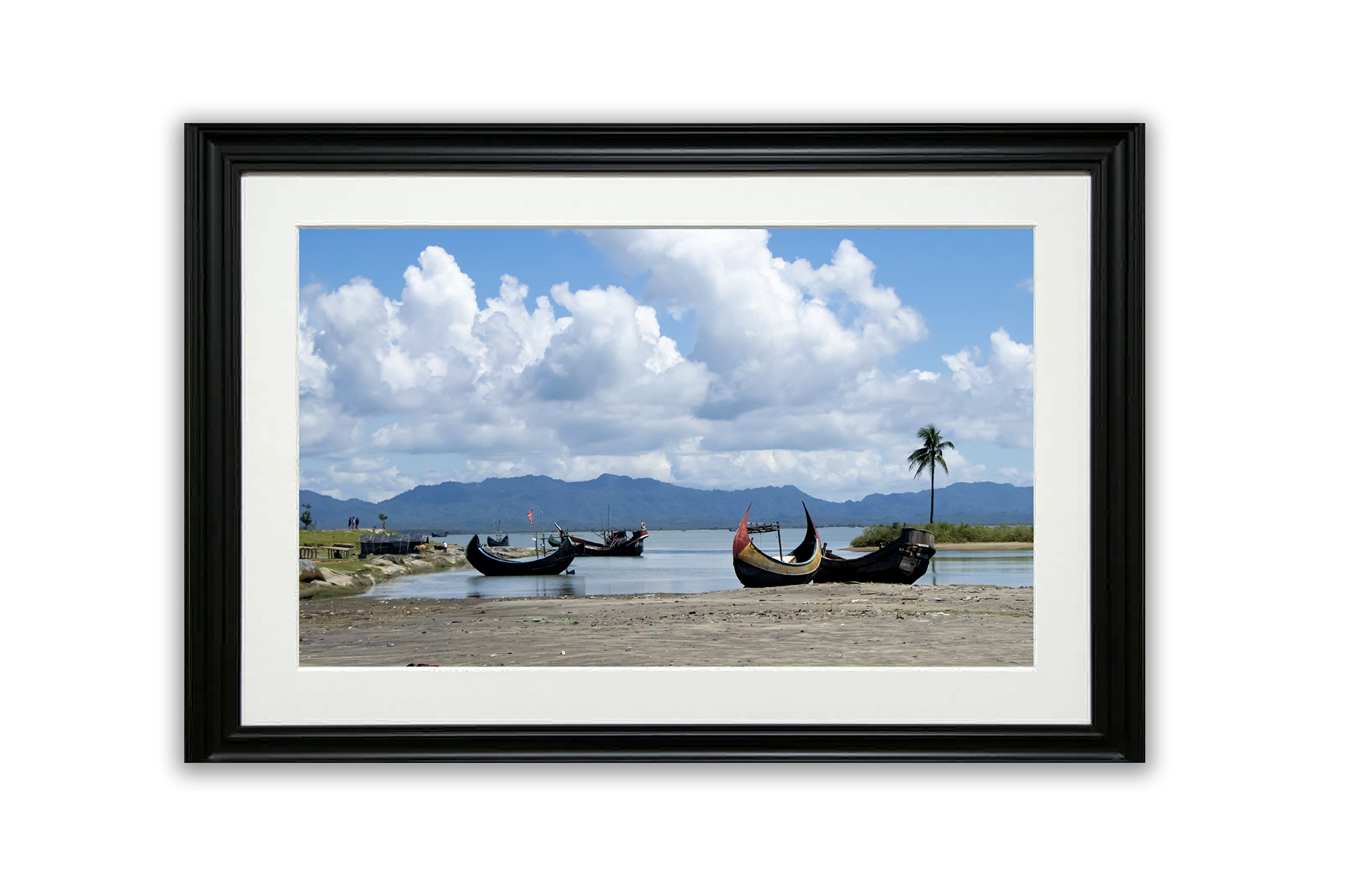 Calm boats by the sea under white clouds at Shah Porir Island