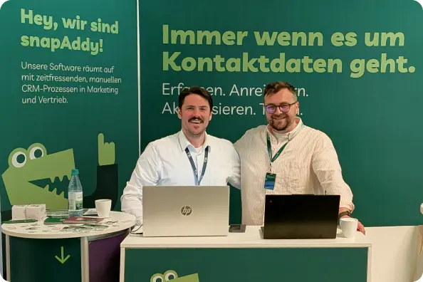 Ben and Michael standing at the snapAddy event booth