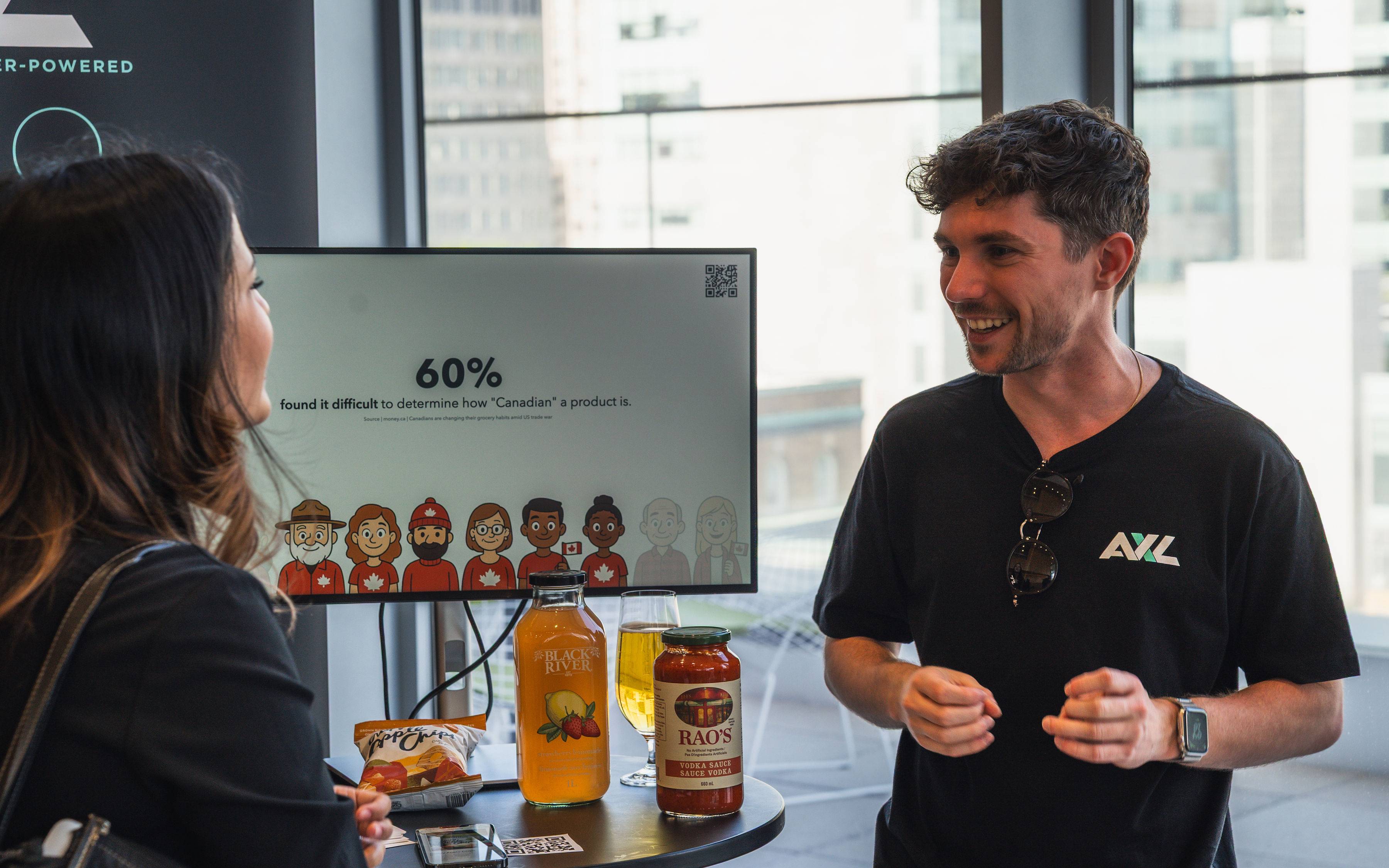 Sasha presenting with a smile at the AXL event.