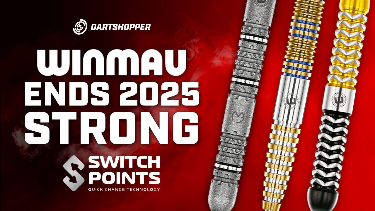 Red ad reading "Winmau ends 2025 strong" with Dartshopper logo, "Switch Points" label and three close-up metallic dart barrels on the right.