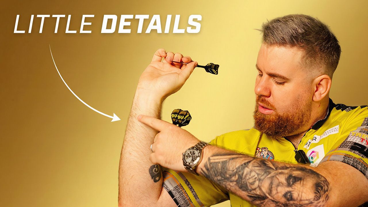 Scott Williams in a yellow sports jersey aiming a dart at his arm, against a gold background with text "LITTLE DETAILS" and an arrow pointing to his arm.