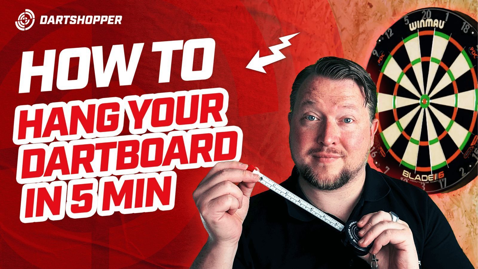 Thumbnail for video tutorial "How to Hang a Dartboard in 5 Minutes" showing a man with a tape measure next to a Winmau Blade 6 dartboard, step-by-step guide for hanging a dartboard at the correct height and distance.