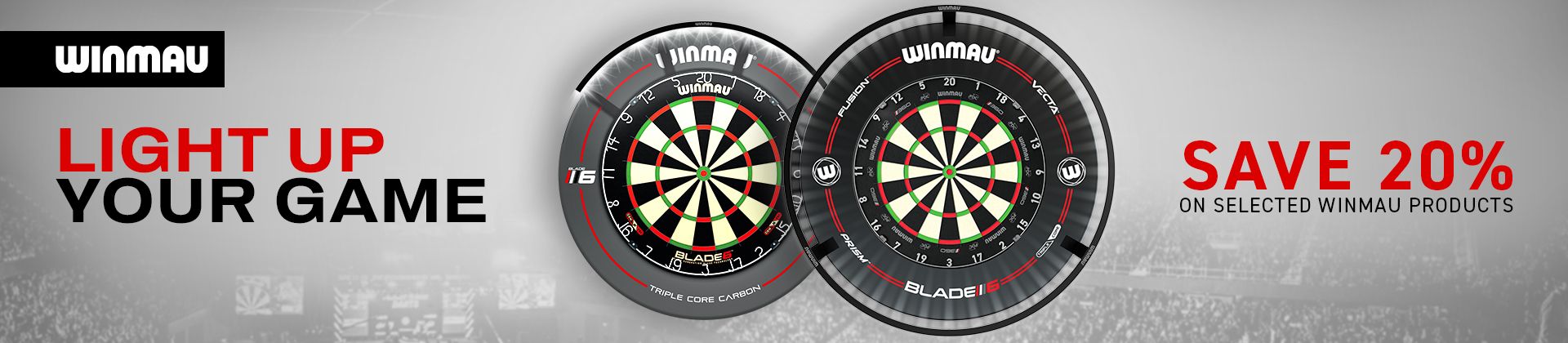 Winmau dartboards with promotional text "Light Up Your Game" and "Save 20% on selected Winmau products" against a blurred stadium backdrop.