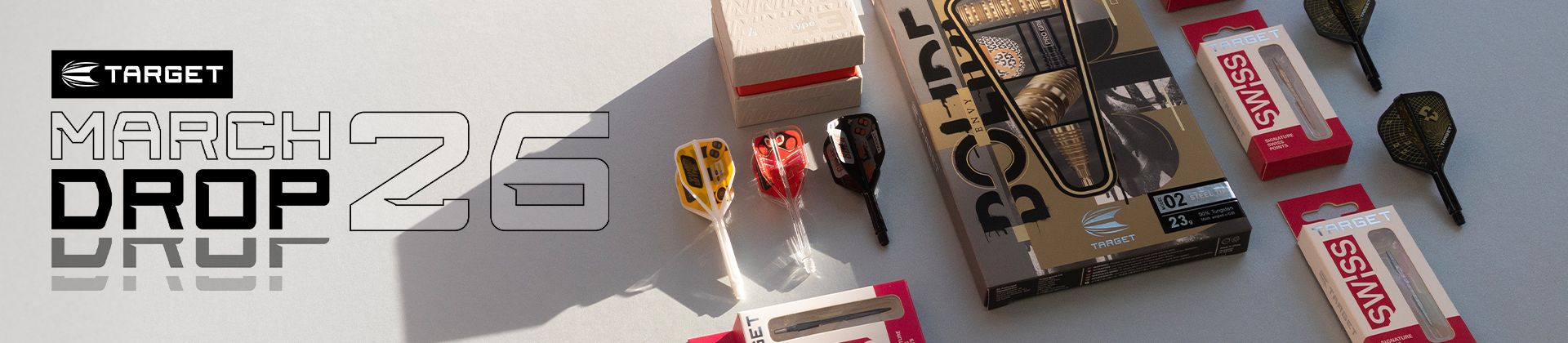 Target's March 26 product launch, featuring Target darts and packaging in shadowed lighting.