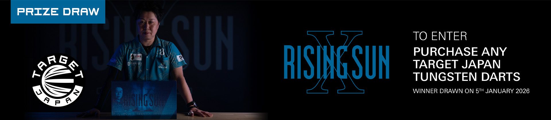 Promotional banner with a person behind a table holding a Rising Sun darts box, Target Japan logo and prize-draw entry text.