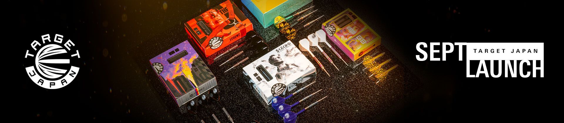 Assortment of dart products with colorful packaging, arranged on a black surface. Text reads "Target Japan September Launch."