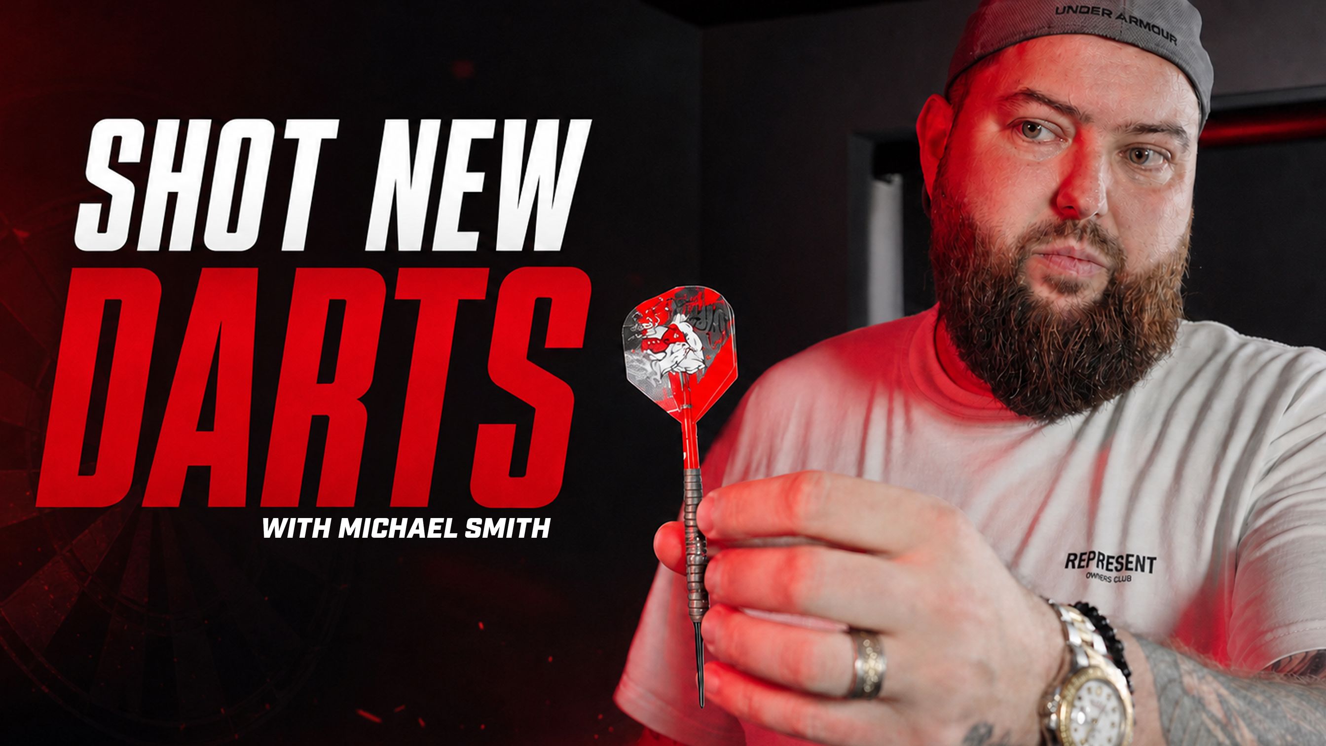 Michael Smith holding a dart, with bold text saying "Shot New Darts with Michael Smith" against a dark background.