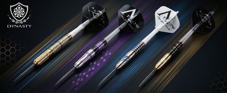 Five colorful, sleek Dynasty darts with metallic barrels and branded flights on a dark background, featuring a Dynasty logo on the left.