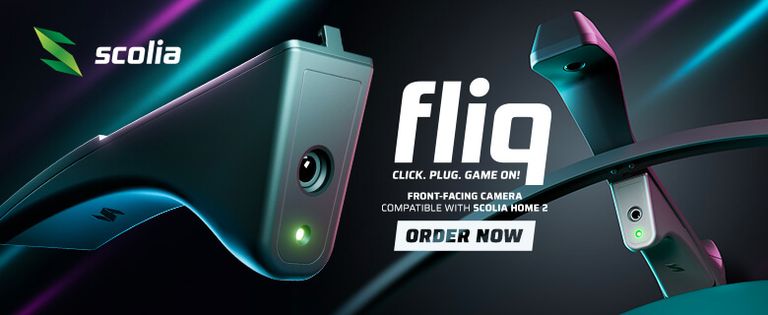 Scolia Fliq dartboard camera advertisement featuring a front-facing camera, with the slogan "Click. Plug. Game On!" and "Order Now" prompt.