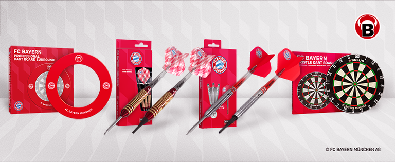 FC Bayern dart set featuring darts, flights, a dartboard, and board surround. Items display the team's logo and colors on a white background.