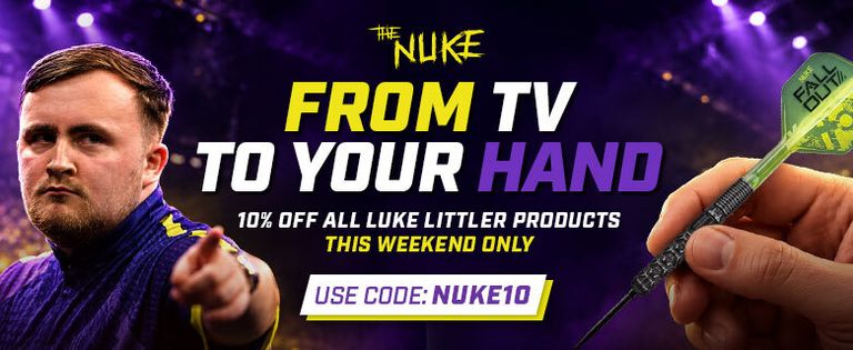 A focused man in a sports jersey holds a dart in a crowded indoor stadium. Text promotes a discount on Luke Littler products with a code.
