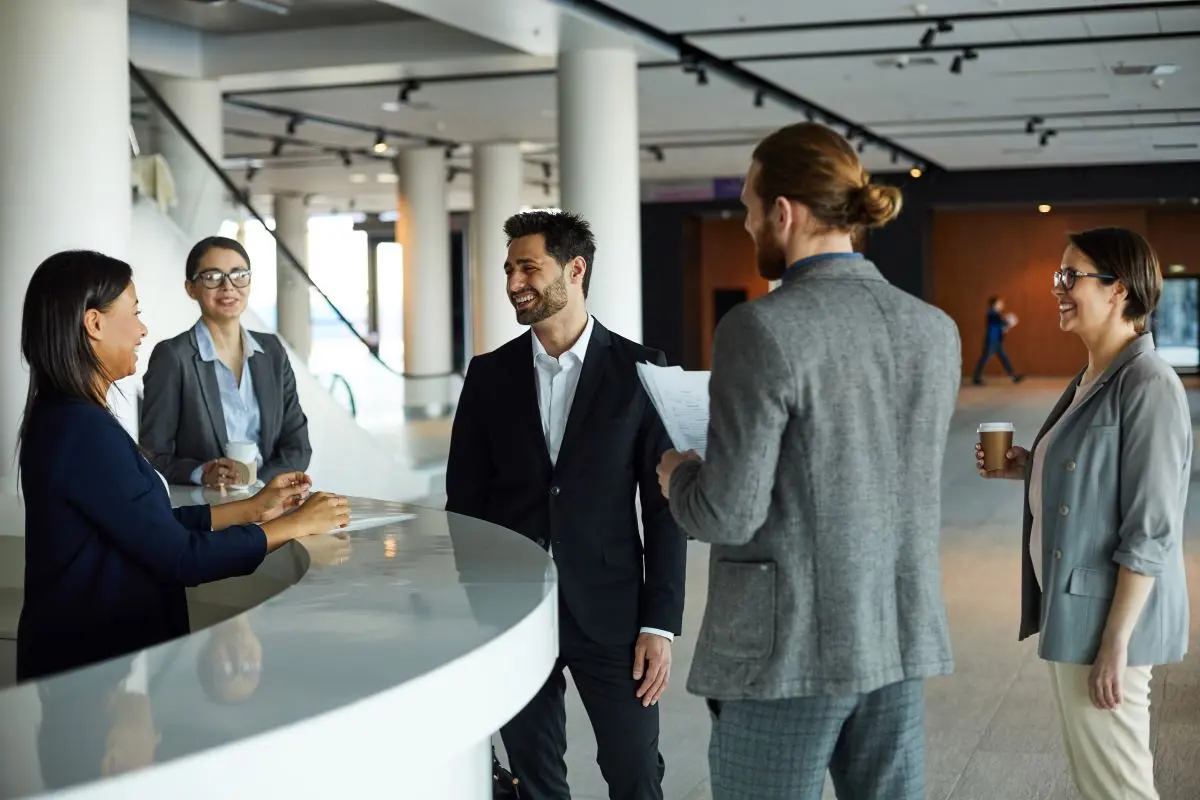 Group Of Travellers At A Hotel Reception