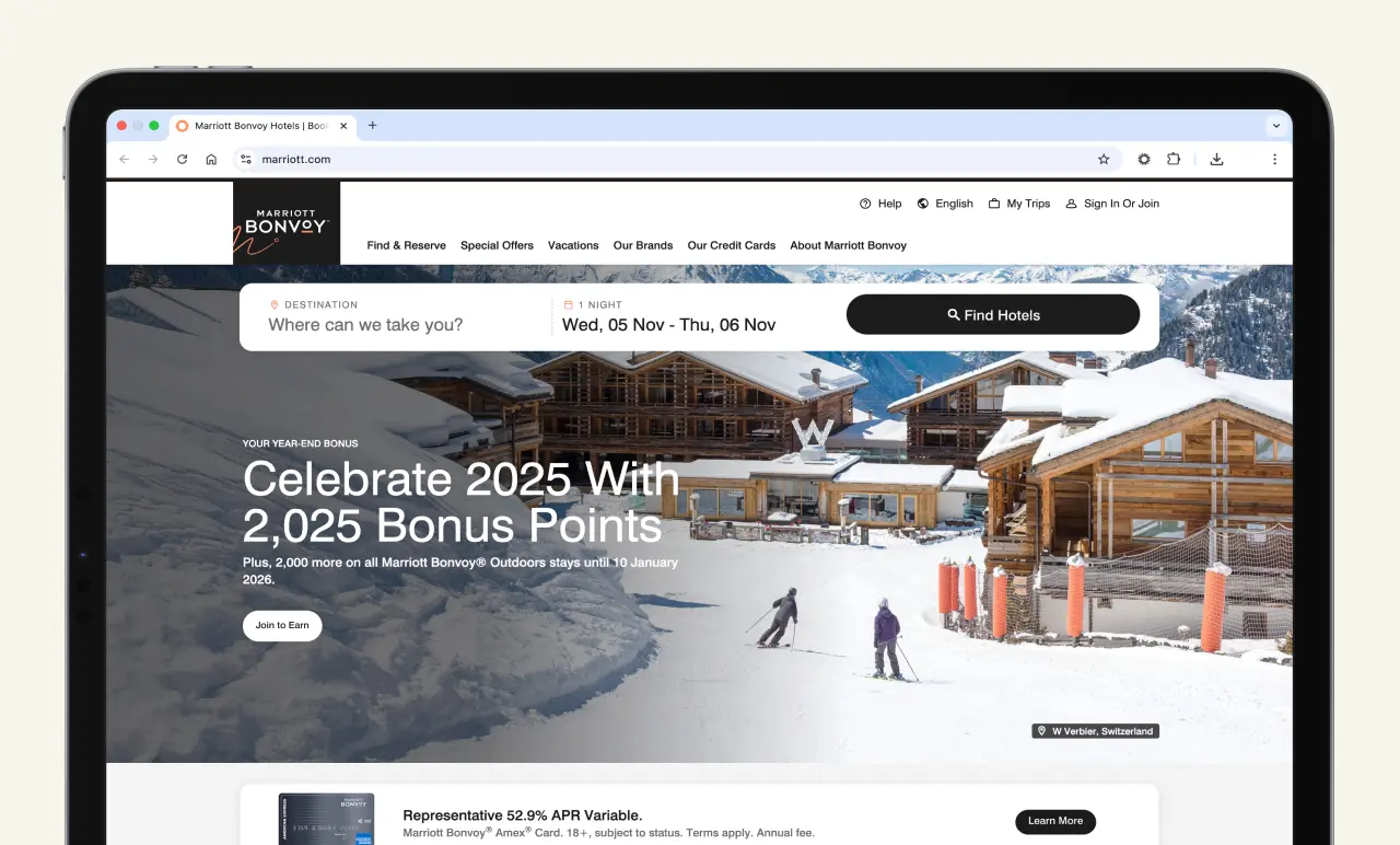 Tablet displaying a Marriott Bonvoy webpage with snowy mountain resort, skiers, and offer for 2,025 bonus points for 2025 stays.
