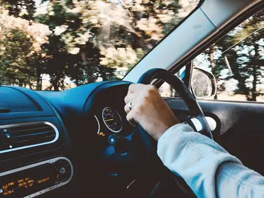 Person driving car Pexels Lisa Fotios 1392621