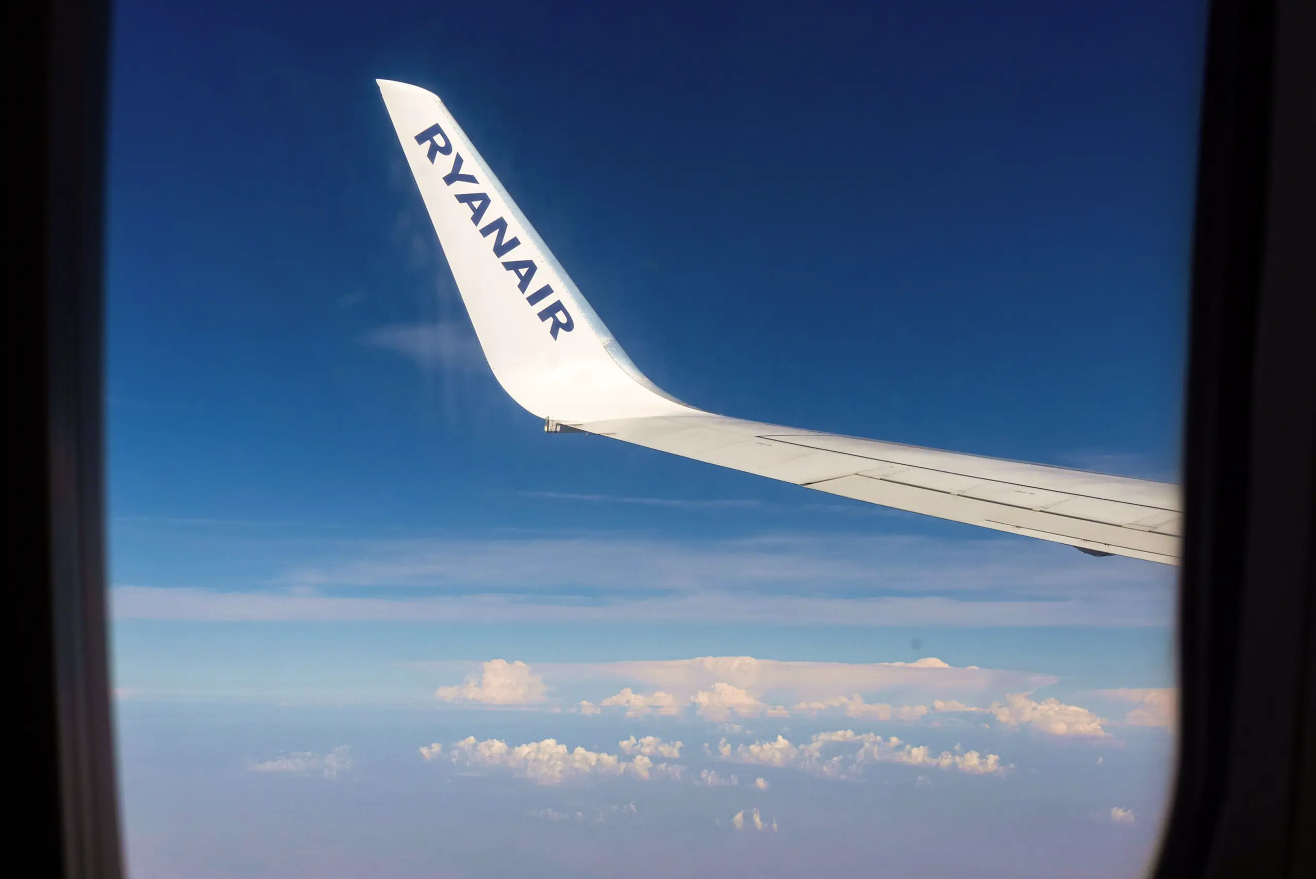 Ryanair Plane Wing Against Blue Sky