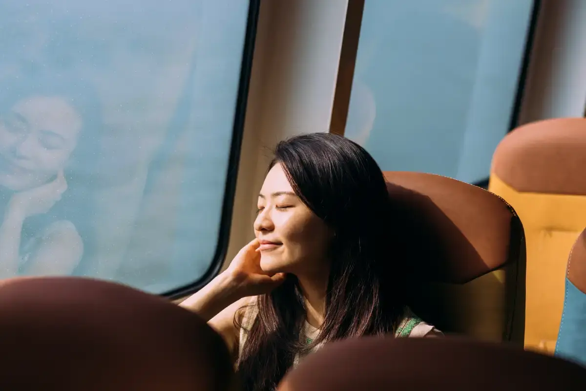 Woman Relaxing By Train Window