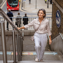 Adult out walking in London on a bright morning.