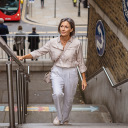 Adult out walking in London on a bright morning.