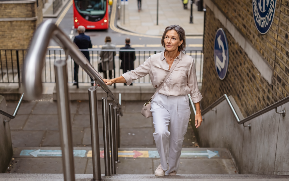Adult out walking in London on a bright morning.