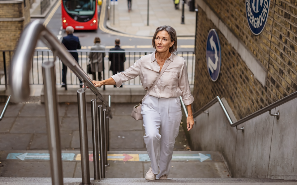 Adult out walking in London on a bright morning.