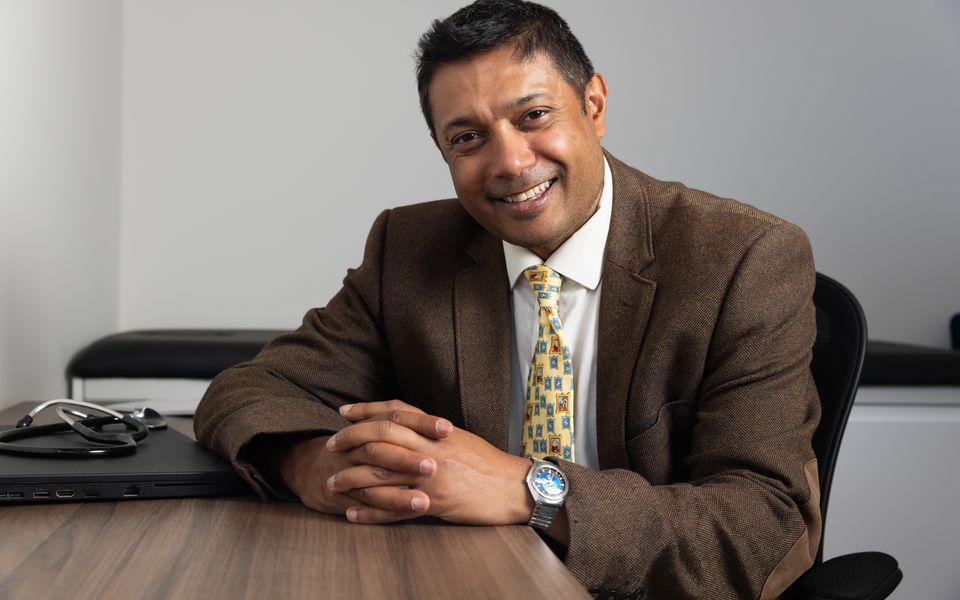 One of our doctors at his consultation desk in the LoveMyLife clinic