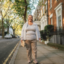 Woman walking home along a London street.