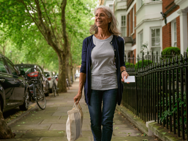 Woman walking along a West London street.
