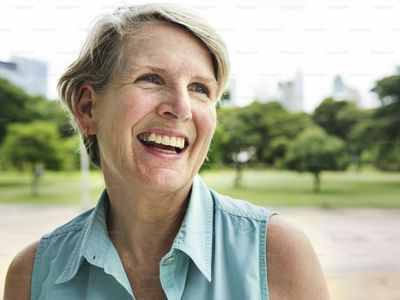 A smiling woman in her fifties