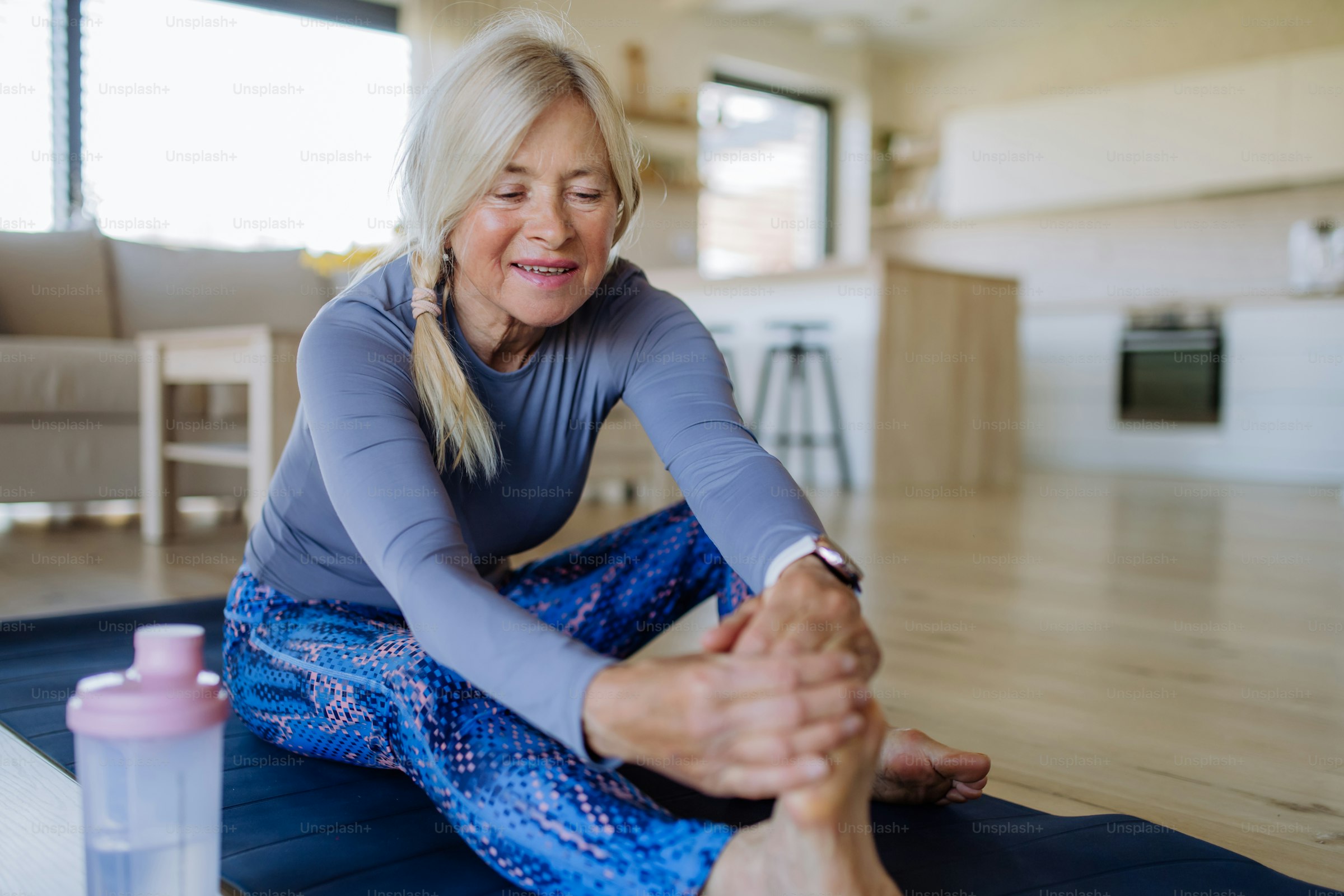 A fit woman in her fifties stretching