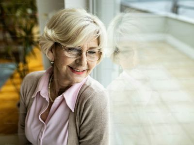 A mature woman sitting and reflecting at home