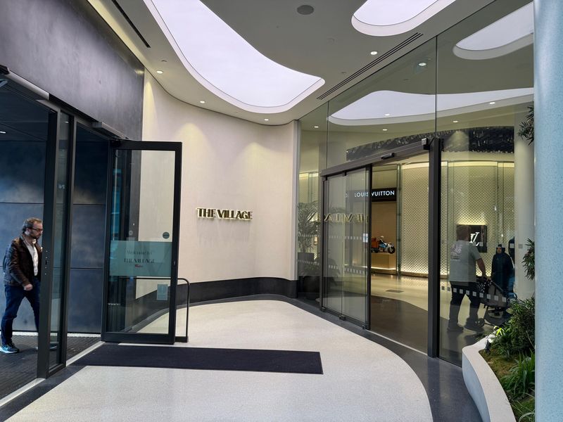 The glass entrance doors to The Village